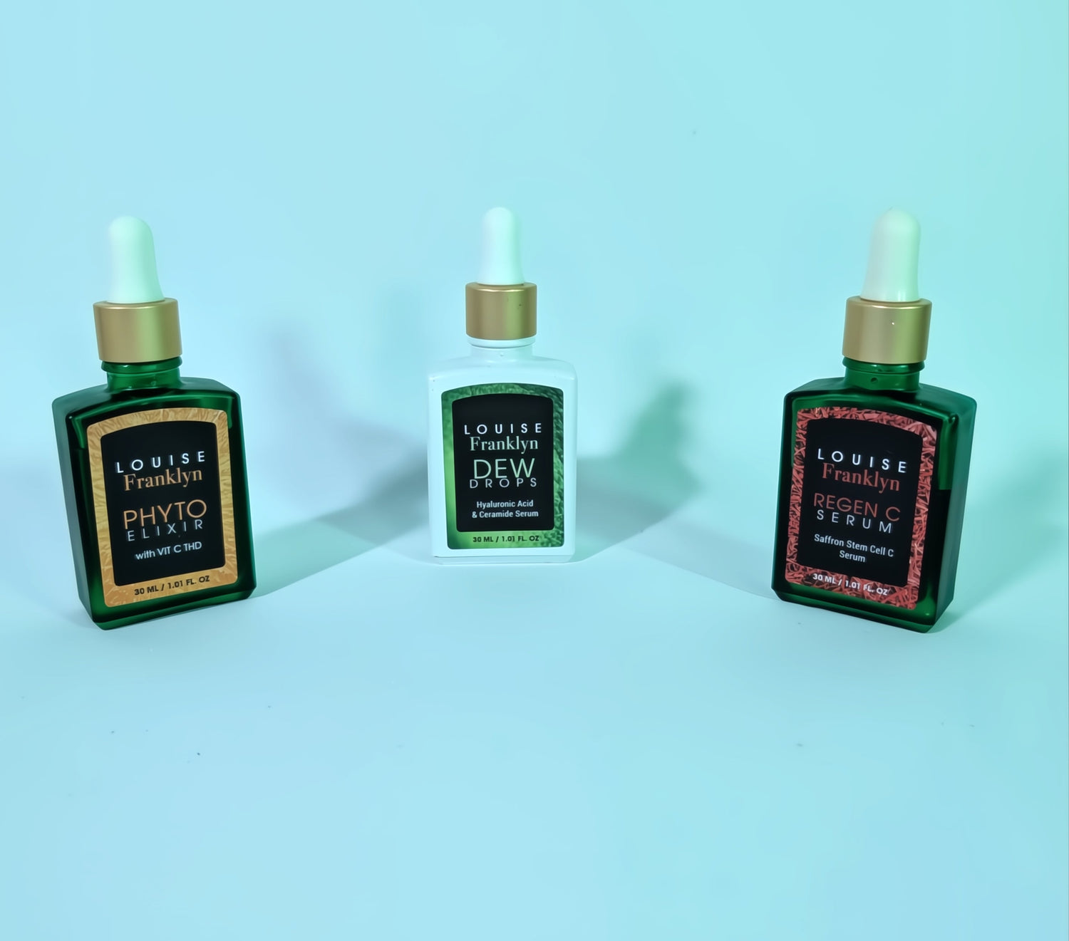 three premium skincare droppers, two are green and one is white. from Louise Franklyn.